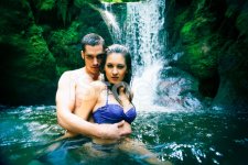 21527789-couple-doing-embracing-under-waterfall.jpg